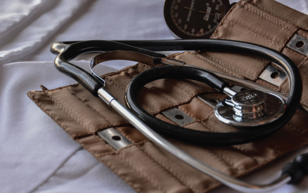 A stethoscope in a brown case