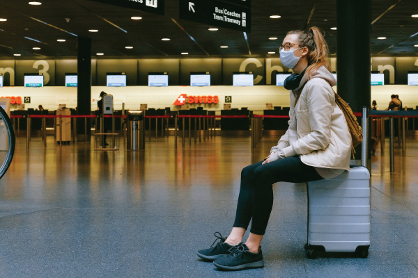 Lady at airport wearing mask