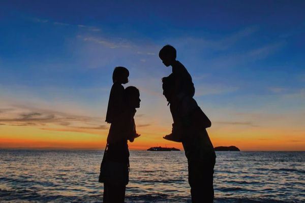 Family at beach at night