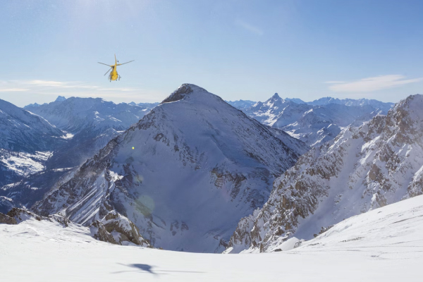 Helicopter in Snow Mountains